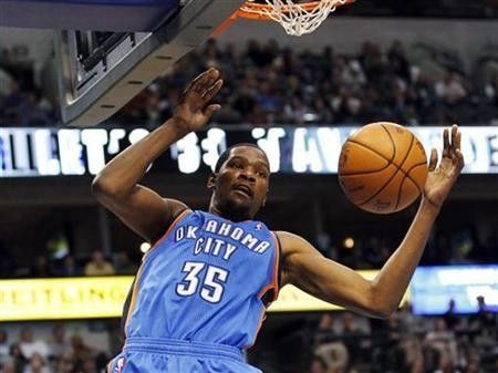 Oklahoma City Thunder forward Kevin Durant dunks against the Dallas Mavericks during the second half of their NBA game in Dallas, Texas January 6, 2011.