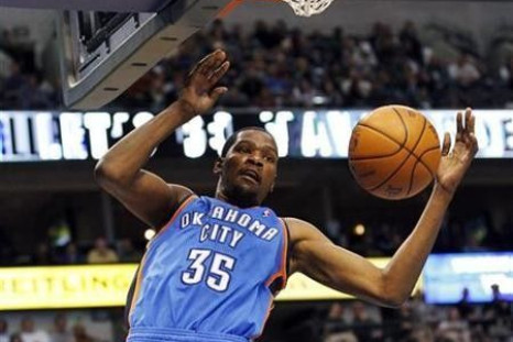 Oklahoma City Thunder forward Kevin Durant dunks against the Dallas Mavericks during the second half of their NBA game in Dallas, Texas January 6, 2011. 
