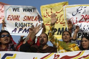Protesters hold up placards while demanding the release of Asia Bibi, a Pakistani Christian woman sentenced to death for blasphemy, at a rally in Faisalabad