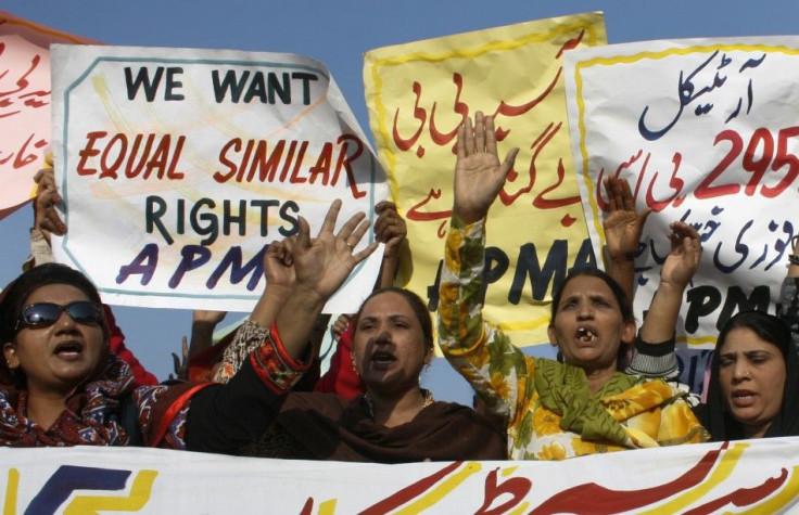 Protesters hold up placards while demanding the release of Asia Bibi, a Pakistani Christian woman sentenced to death for blasphemy, at a rally in Faisalabad