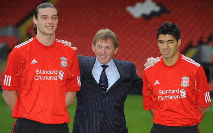 Liverpool soccer club's new signings Carroll and Suarez pose for photographers with coach Dalglish at Anfield stadium in Liverpool.