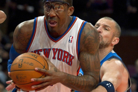 Dallas Mavericks guard Jason Kidd tries to steal the ball from New York Knicks center Amar'e Stoudemire (L) in the second quarter of their NBA basketball game at Madison Square Garden in New York, February 2, 2011.