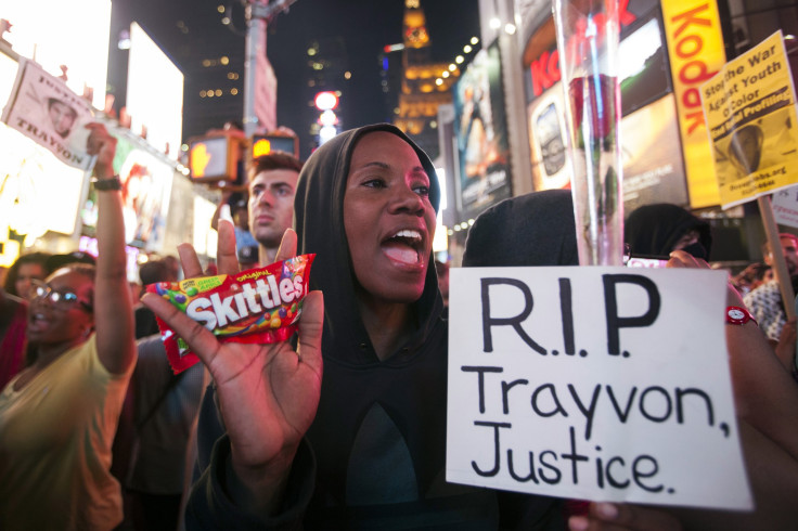 Protester Keisha Martin-Hall holds a bag of Skittles as she participates in a rally in response to the acquittal of George Zimmerman in the Trayvon Martin trial in Times Square in New York