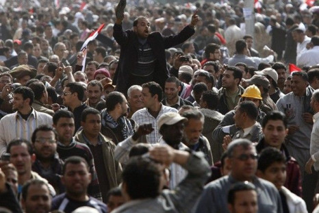 An opposition supporter waves his shoe, a sign of disrespect, shortly after Friday prayers in Tahrir Square in Cairo February 4, 2011. 