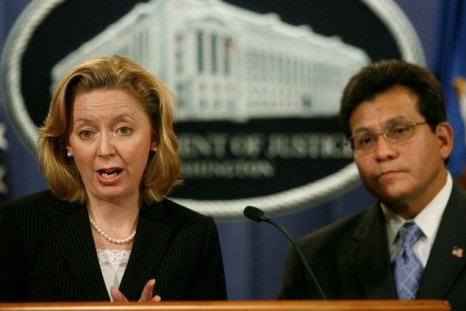 U.S. Federal Trade Commission Chairman Deborah Platt Majoras speaks to the press alongside U.S. Attorney General Alberto Gonzales following a meeting of the Identity Theft Task Force at the Justice Department in Washington, September 19, 2006.