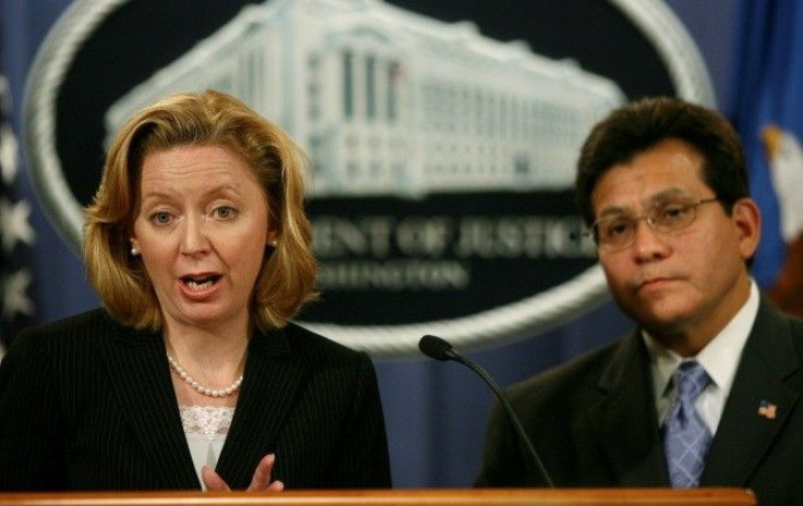 U.S. Federal Trade Commission Chairman Deborah Platt Majoras speaks to the press alongside U.S. Attorney General Alberto Gonzales following a meeting of the Identity Theft Task Force at the Justice Department in Washington, September 19, 2006.