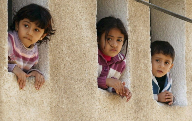 Palestinian children watch the funeral of Islamic Jihad militant Jalal Nasir in Jabalya, in the northern Gaza Strip