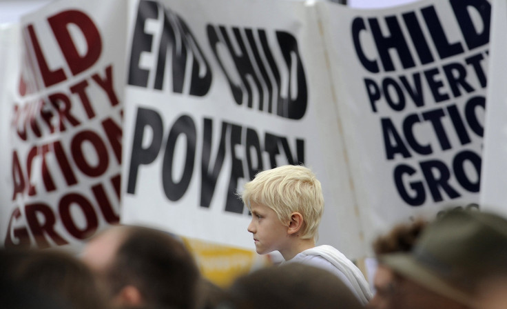 Demonstrators listen to speakers at a rally in Trafalgar Square in central London