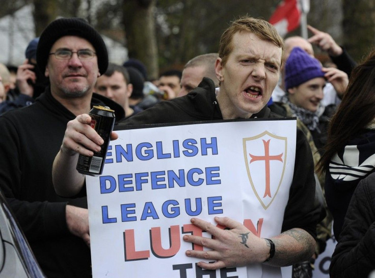 A supporter of the English Defence League gestures during a demonstration in Luton
