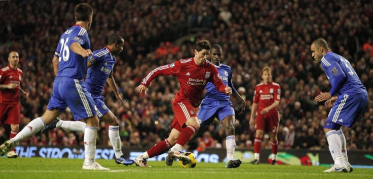 Ex-Liverpool man Torres runs through the Chelsea defence in their previous encounter against each other, in which he scored two goals for Liverpool against his new team.