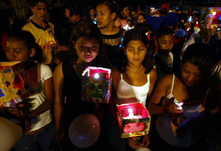 Children hold candles during a demonstration to condemn violence against children in Tegucigalpa 