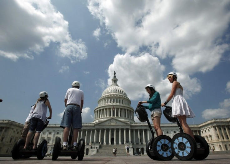 A group of tourists on Segway personal transporters take a guided tour of Capitol Hill in Washington. Americans surveyed seemed to suggest that the economy-rattled, notoriously isolationist Americans are set to take to the road more during 2011.