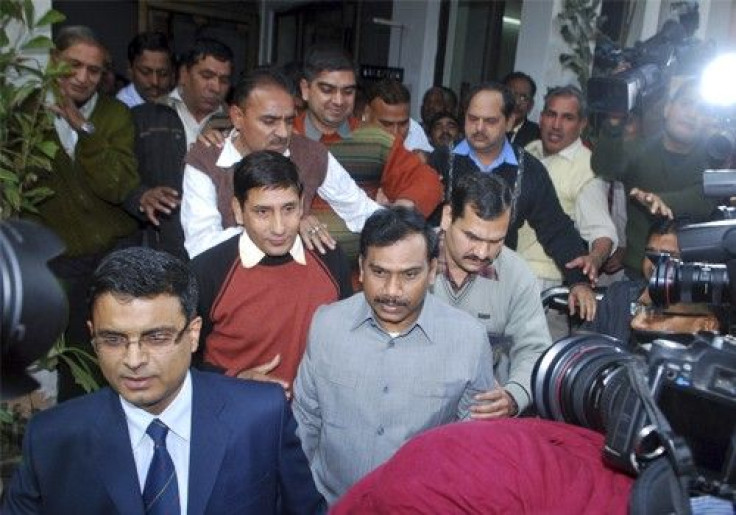 India's former telecommunications minister Andimuthu Raja (C) leaves India's Central Bureau of Investigation (CBI) headquarters in New Delhi February 3, 2011