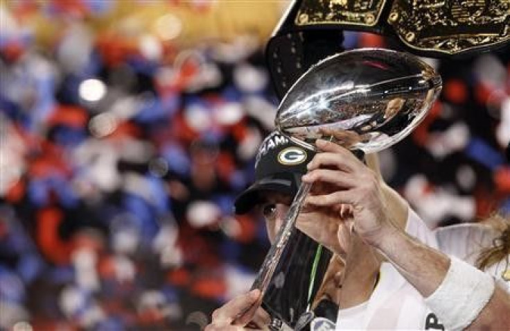Green Bay Packers' quarterback Aaron Rodgers holds the Vince Lombardi Trophy after his team defeated the Pittsburgh Steelers, 31-25, in the NFL's Super Bowl XLV football game in Arlington, Texas, February 6, 2011. 