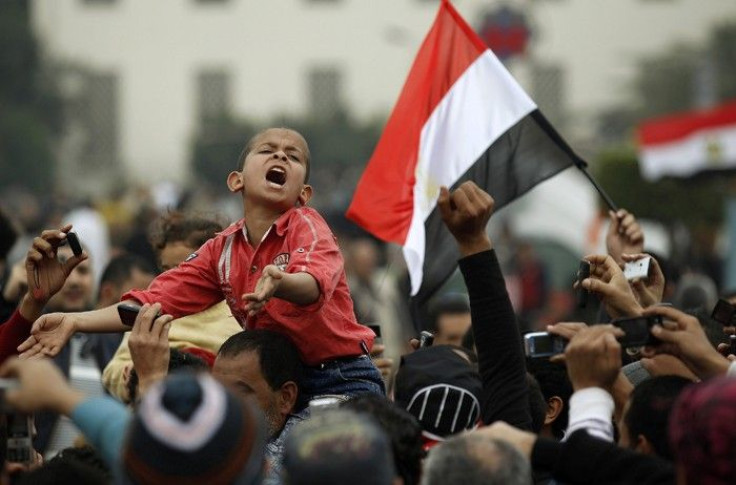 A young protester chants anti-government slogans during demonstrations inside Tahrir Square in Cairo