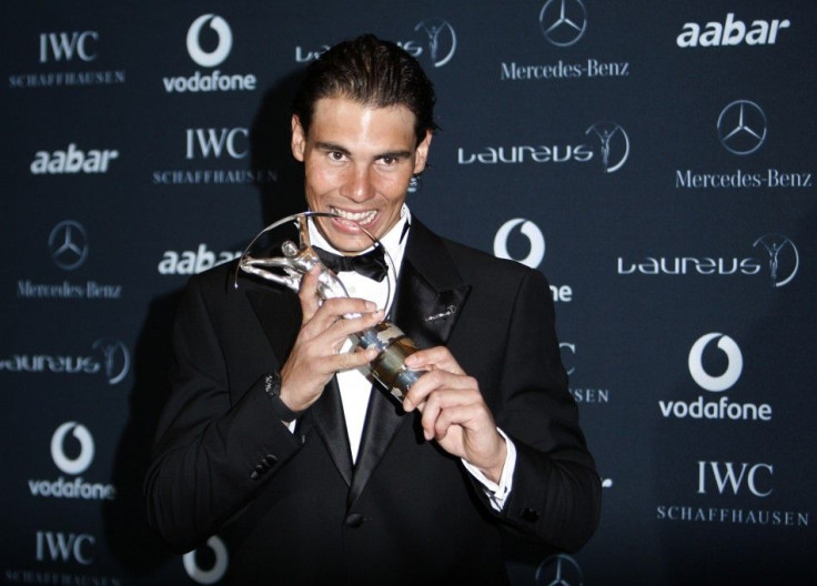 Tennis champion Nadal poses with his Laureus World Sportsman of the Year Award at Emirates Palace in Abu Dhabi.