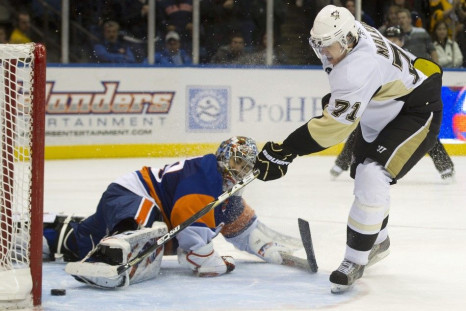 Pittsburgh Penguins center Malkin scores past New York Islanders goalie DiPietro in a shootout in Uniondale, New York.