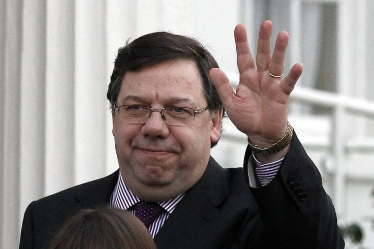 Irish Prime Minister Brian Cowen waves as he leaves the residence of President Mary McAleese, after announcing the dissolution of parliament and setting February 25 as the date for Ireland's general election, Dublin February 1, 2011. 