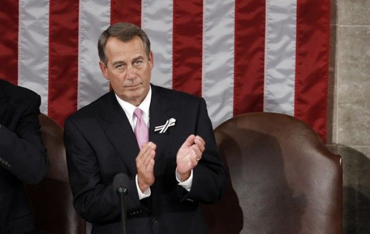 Newly elected Speaker of the House John Boehner (R-OH) applauds U.S. President Barack Obama as he arrives in the House Chamber to deliver his State of the Union address to a joint session of Congress on Capitol Hill in Washington, January 25, 2011. 