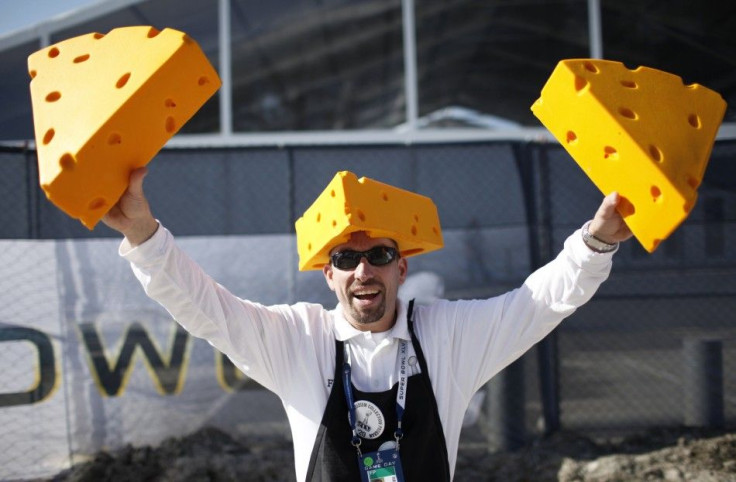 A vendor holds up Green Bay Packers cheese hats for sale outside Cowboys Stadium before the start of the NFL's Super Bowl XLV football game in Arlington.