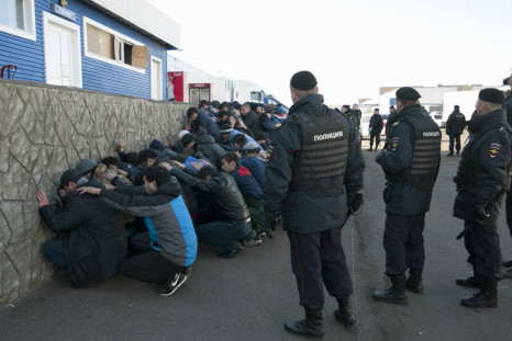 Russian police detain migrants