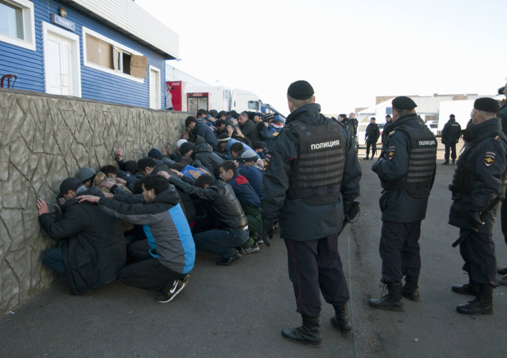 Russian police detain migrants