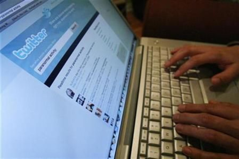 A Twitter page is displayed on a laptop computer in Los Angeles