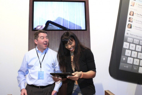 Pettitt gives pointers to Williams as she helps demonstrate the TouchPad after a media presentation at the Herbst Pavilion at the Fort Mason Center in San Francisco