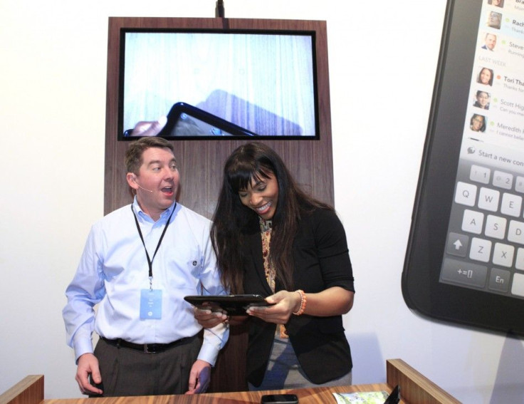 Pettitt gives pointers to Williams as she helps demonstrate the TouchPad after a media presentation at the Herbst Pavilion at the Fort Mason Center in San Francisco