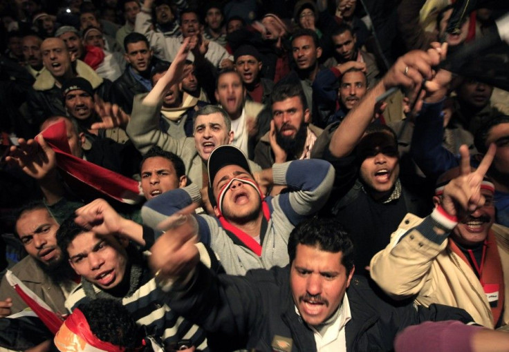 Opposition supporters shout in their stronghold of Tahrir Square