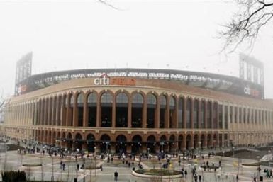 Baseball fans arrive at the Mets&#039; new stadium before a MLB exhibition baseball game in New York