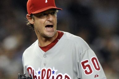 Philadelphia Phillies starting pitcher Jamie Moyer reacts after he got New York Yankees batter Jorge Posada to pop out in the eighth inning of their MLB inter-league baseball game at Yankee Stadium in New York, June 16, 2010. 