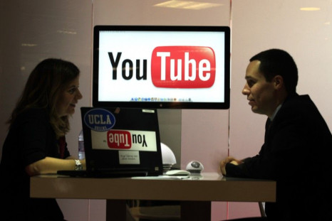 Visitors are seen at &quot;You Tube&quot; stand during the MIDEM in Cannes
