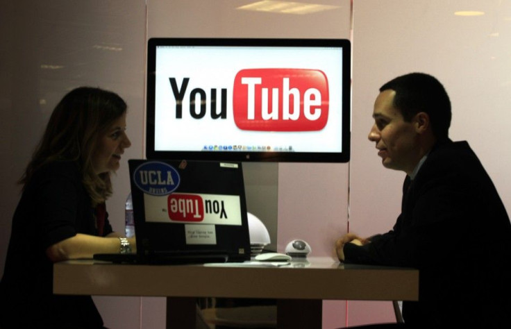 Visitors are seen at &quot;You Tube&quot; stand during the MIDEM in Cannes