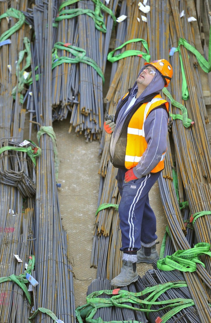 A construction worker stands amongst steel rods at the Shard building skyscraper site in central London February 9, 2011.
