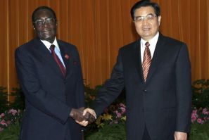 Zimbabwe's President Mugabe shakes hands with China's President Hu in Beijing