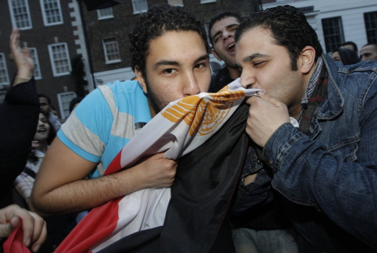 Egyptians and supporters celebrate the resignation of Egypt's President Hosni Mubarak outside the country's embassy in London