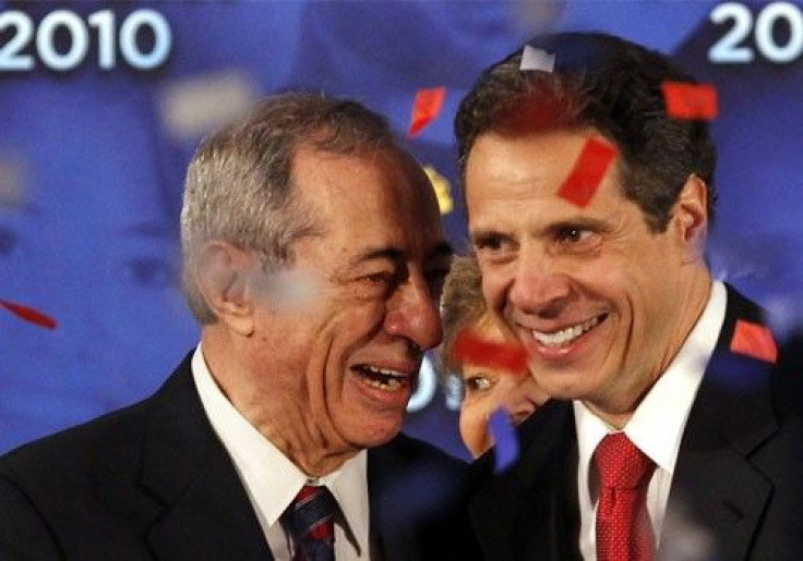 New York Governor Andrew Cuomo (R) shares a laugh with his father former New York Governor Mario Cuomo