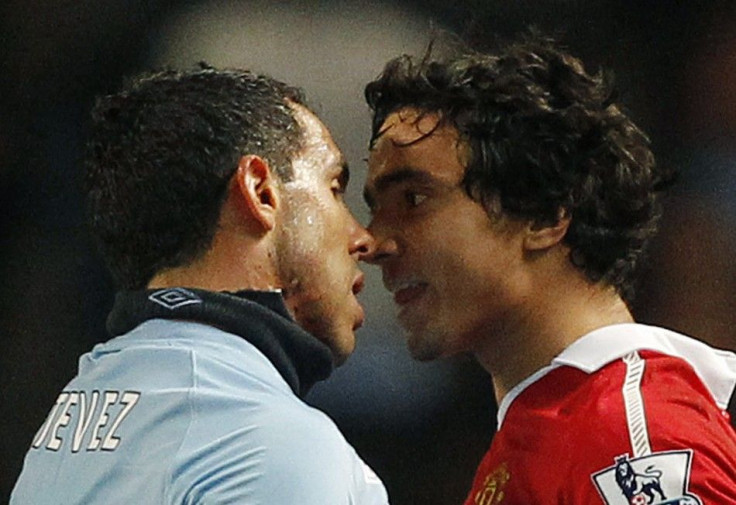Manchester City's Tevez squares up with Manchester United's Rafael during their English Premier League soccer match at the City of Manchester Stadium in Manchester.