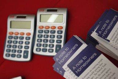 Flyers are stacked beside calculators at the Housing Fair put on by the National Urban League's Economic Empowerment Tour in Dallas, Texas June 13, 2009.