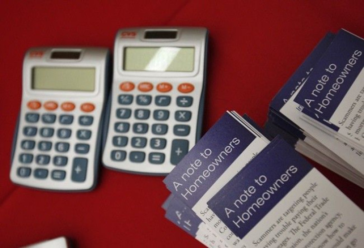 Flyers are stacked beside calculators at the Housing Fair put on by the National Urban League's Economic Empowerment Tour in Dallas, Texas June 13, 2009.