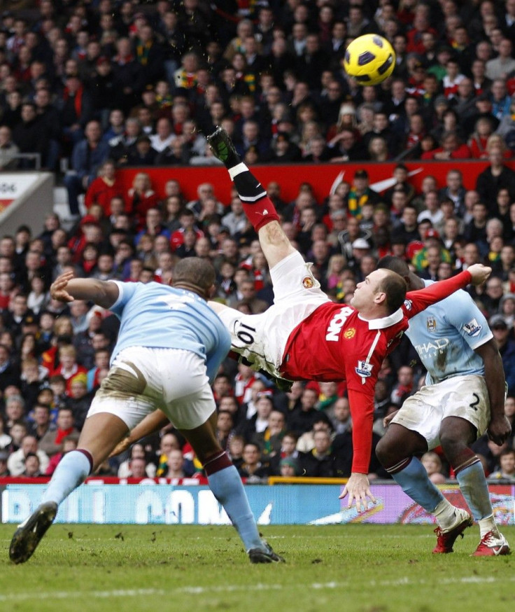 Manchester United's Wayne Rooney scores against Manchester City from an overhead kick during their English Premier League soccer match at Old Trafford in Manchester.