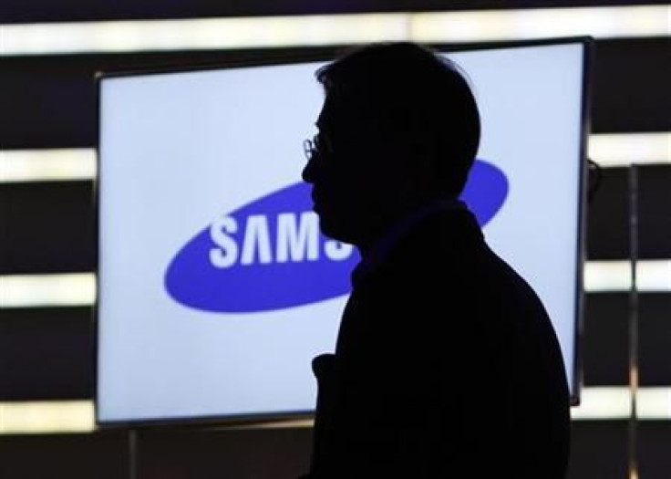 Yoon Boo-keun, head of Samsung&#039;s TV division, watches a video at the Samsung keynote address on the opening day of the Consumer Electronics Show (CES) in Las Vegas