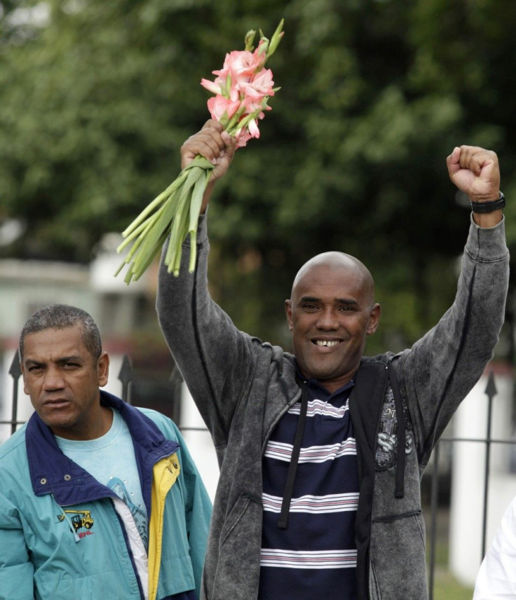 Recently liberated Cuban dissident Angel Moya reacts during the weekly protest of the &quot;Ladies in White&quot; in Havana