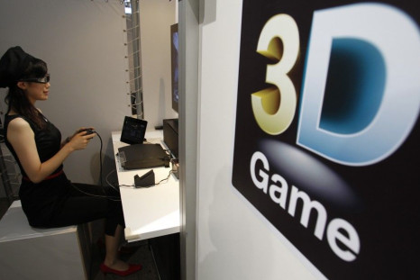 An attendant demonstrates Sony's 3D game on the PlayStation 3 game console at Tokyo Game Show in Chiba