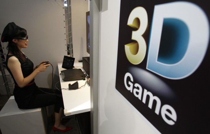 An attendant demonstrates Sony's 3D game on the PlayStation 3 game console at Tokyo Game Show in Chiba