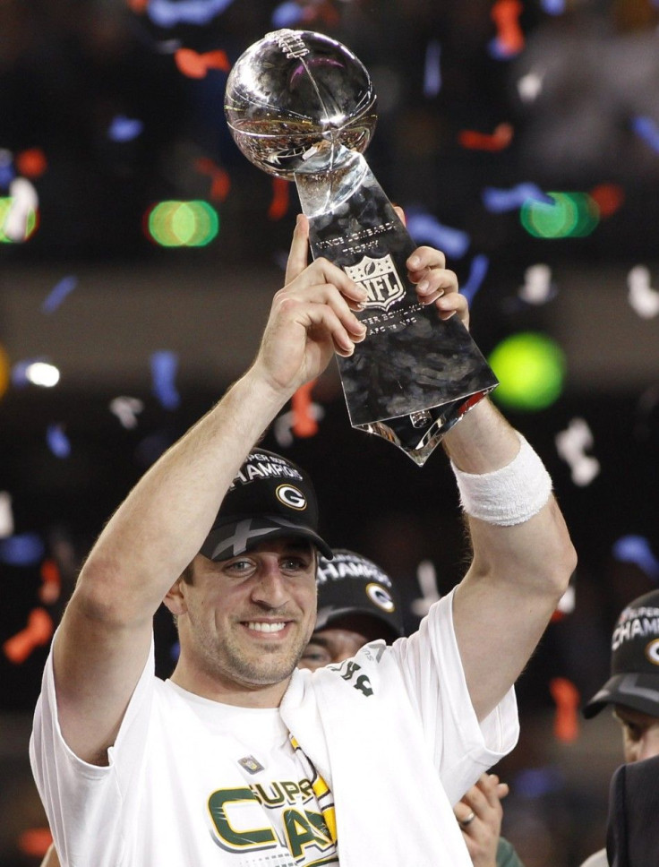 Packers' Rodgers holds up the Vince Lombardi Trophy after his team defeated the Steelers in the NFL's Super Bowl XLV football game in Arlington.