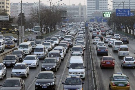 Cars travel on a main road in a traffic jam at the second ring road in Beijing