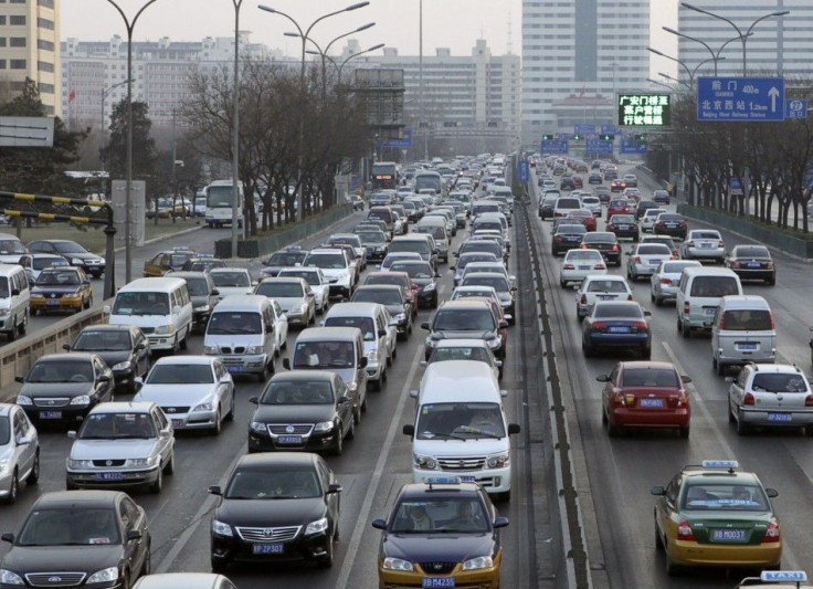 Cars travel on a main road in a traffic jam at the second ring road in Beijing