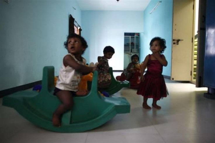 Baby girls play inside the Life Line Trust orphanage in Salem in Tamil Nadu